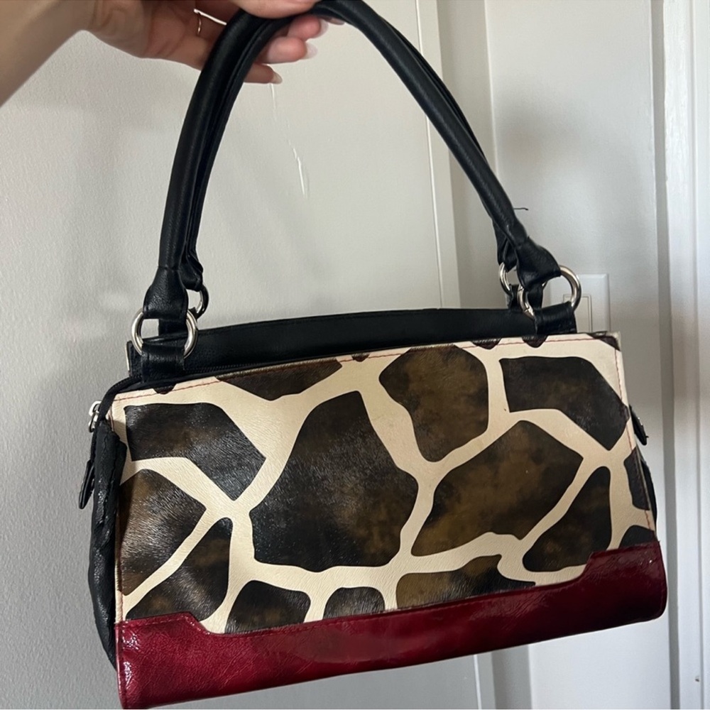 Stylish Giraffe Print Handbag with Black and Red Accents